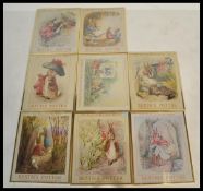 A collection of eight framed and glazed Beatrix Potter prints featuring Peter Rabbit and friends,