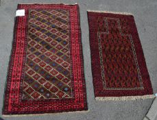 A pair of contemporary floor rugs with red ground. The dimensions for the rugs are 133cmx 78cm and