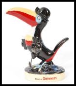 A Royal Doulton advertising ceramic figurine Guinness Miner Toucan MCL12. Limited edition 1214/2000.