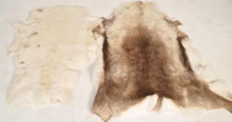2  vintage 20th century Reindeer skin taxidermy floor rugs / rug of typical form. Please see
