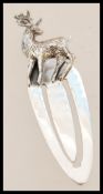 A contemporary sterling silver novelty bookmark with a stag finial top.