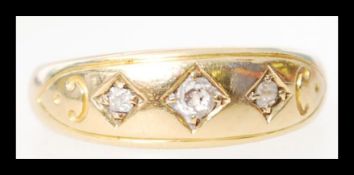 An 18ct gold and diamond 3 stone ring hallmarked for Chester 1910, makers T&S. The diamonds approx