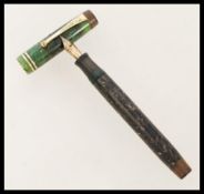 A vintage 20th century Parker Duofold fountain pen with yellow metal nib.