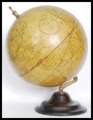 A vintage style 20th century large desk top globe in the antique style raised on a heavy wooden