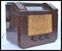 A vintage retro 20th century GEC bakelite radio having a grille front with glass panel dial. AC