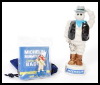 A set of four Wade advertising ceramic figurines for Michelin to include Sailor Bibendum 9/750,