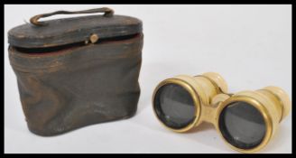 A pair of 19th century Victorian ivory opera glasses of larger form having brass mounts. Complete in