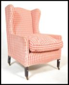 An early 20th century Edwardian mahogany wing back