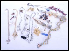 A group of vintage costume jewellery to include brooches, cufflinks, necklaces etc. Brooches to