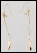 A pair of high carat 22ct gold testing drop earrings having curb linked droplets. Weighs 2.7 grams.
