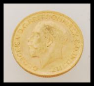 An early 20th century George V full sovereign gold coin dated 1913. Weighs 7.98 grams.