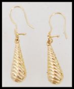 A pair of high carat 22ct gold testing large drop earrings having reeded droplets. Weighs 4.7