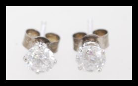 A pair of 14ct white gold diamond stud earrings of 1.1cts. The earrings weigh 0.7 grams and the