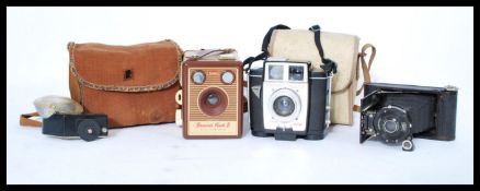 A collection of cameras to include a small Zeiss IkonI konette , Brownie Twin 20 and a Brownie Flash