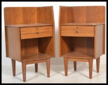 A good mid century Danish influence teak wood  pair of bedside cabinets. Each with gallery tops over