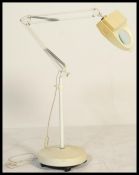 A vintage 1970's floorstanding dentists / medical anglepoise lamp with inset magnifying glass.
