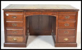 A 1920's oak Industrial large twin pedestal office desk. Raised on plinth base to each having