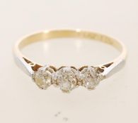 An 18ct three stone diamond ring, prong set in platinum with 0.25ct diamonds. Item weight 1.4