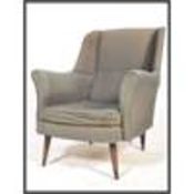 A mid century armchair in the manner of Robin Day