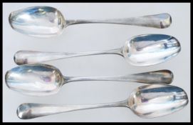 A set of 4 19th century George III silver hallmarked table spoons bearing hallmarks for London 1804