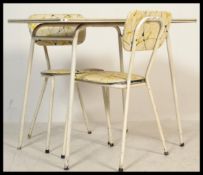A vintage retro mid 20th century 1950's Formica table and chairs raised on white tubular metal