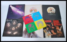 Queen - A collection of vinyl long play LP records by Queen to include A Night At The Opera, A Day