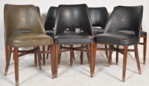 A set of seven vintage retro 20th century chairs raised on tapering supports with vinyl