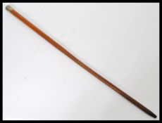 A period silver hallmarked walking stick cane having a tapering Malacca wood shaft with silver