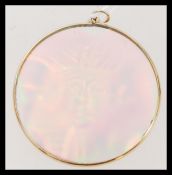 An unusual Egyptian holographic necklace pendant of circular form having a yellow metal testing as