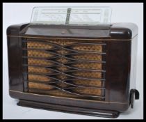 A vintage 20th Century Art Deco Philips bakelite valve radio Type 462 A / 15, the fabric covered