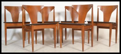 Elliots of Newbury - A set of four vintage 20th century teak dining chairs having black vinyl