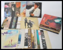 A collection of vinyl log play vinyl LP records featuring various artists to include The Beatles -