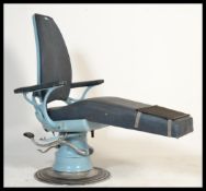A retro vintage 20th century Dentists  chair in the original blue  colourway. Chrome base with