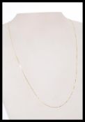 A 9ct / 375  marked gold fine link necklace chain. Total length 49cms / weight 0.6g