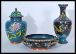 A group of three early 20th century cloisonne wares to include lidded vase, baluster vase and