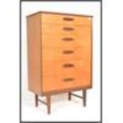 A vintage mid century Danish style upright pedestal chest of drawers with inset detail handles to