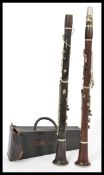A pair of Rosewood ' A ' & ' B ' rosewood clarinets dating from the early part of the 20th century