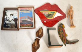 A collection of retro items to include a lips mirror, taxidermy deer foot coat rack, wooden