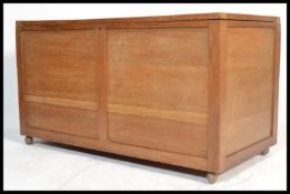 A large 1930's oversized blanket box - linen chest. Golden oak panelled construction with hinged lid