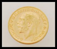 An early 20th century George V full sovereign gold coin dated 1911. Weighs 7.98 grams.