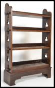 A 19th century Victorian oak arts and crafts Gothic revival bookshelf being peg jointed raised on