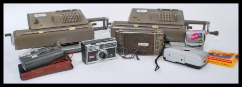 A pair of vintage 20th Century Industrial Nippon calculators together with a selection of vintage