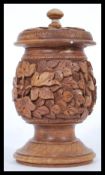 A vintage mid 20th century Kasmir carved wooden tobacco  box raised on circular base with leaf