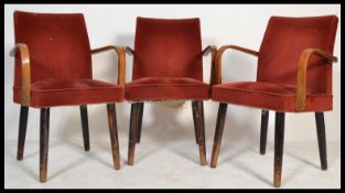 A set of three retro 20th century vintage Ben Chairs style bridge / dining chairs raised on