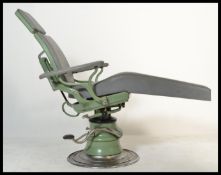 A retro vintage 20th century Dentists  chair in theoriginal green colourway. Chrome base with foot