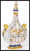 An Italian Majolica Fiance pilgrim moon flask / vase raised on a pedestal base with scrolled