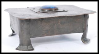 A Tudric pewter Art Nouveau lidded trinket pot in the manner of Archibald Knox of Liberties. The box