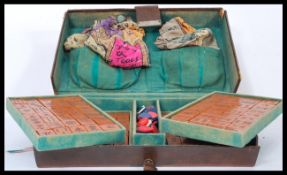 A vintage early 20th century Mah Jong set brought home from Malaya in the early part of the 20th