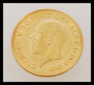 An early 20th century George V full sovereign gold coin dated 1929. Weighs 7.98 grams.