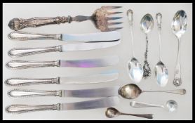 A group of silver hallmarked and silver handled flatware / cutlery to include a set of six knives,